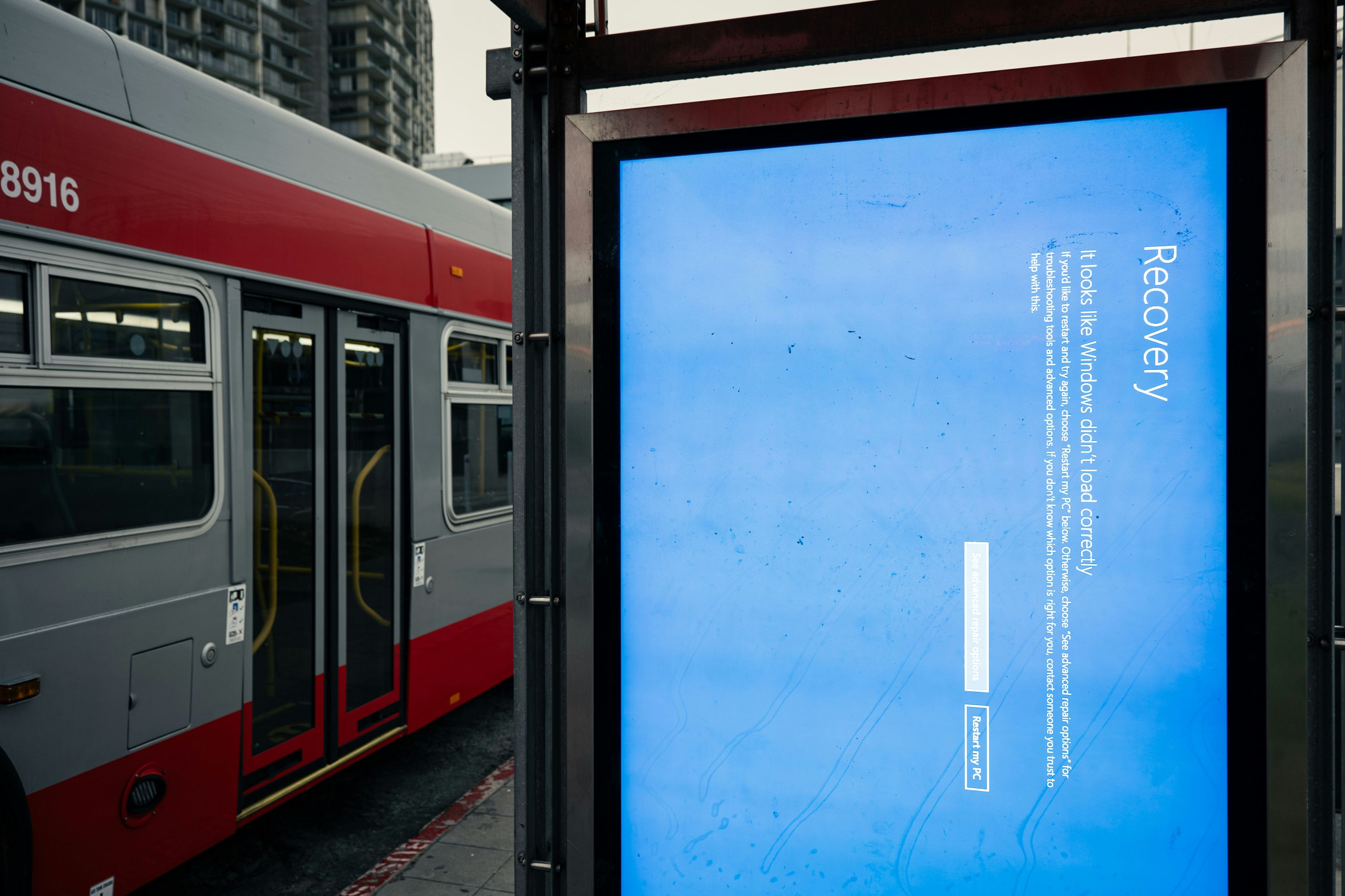 A blue screen of death displaying on a bus stop because of the Microsoft-Crowdstrike outage.