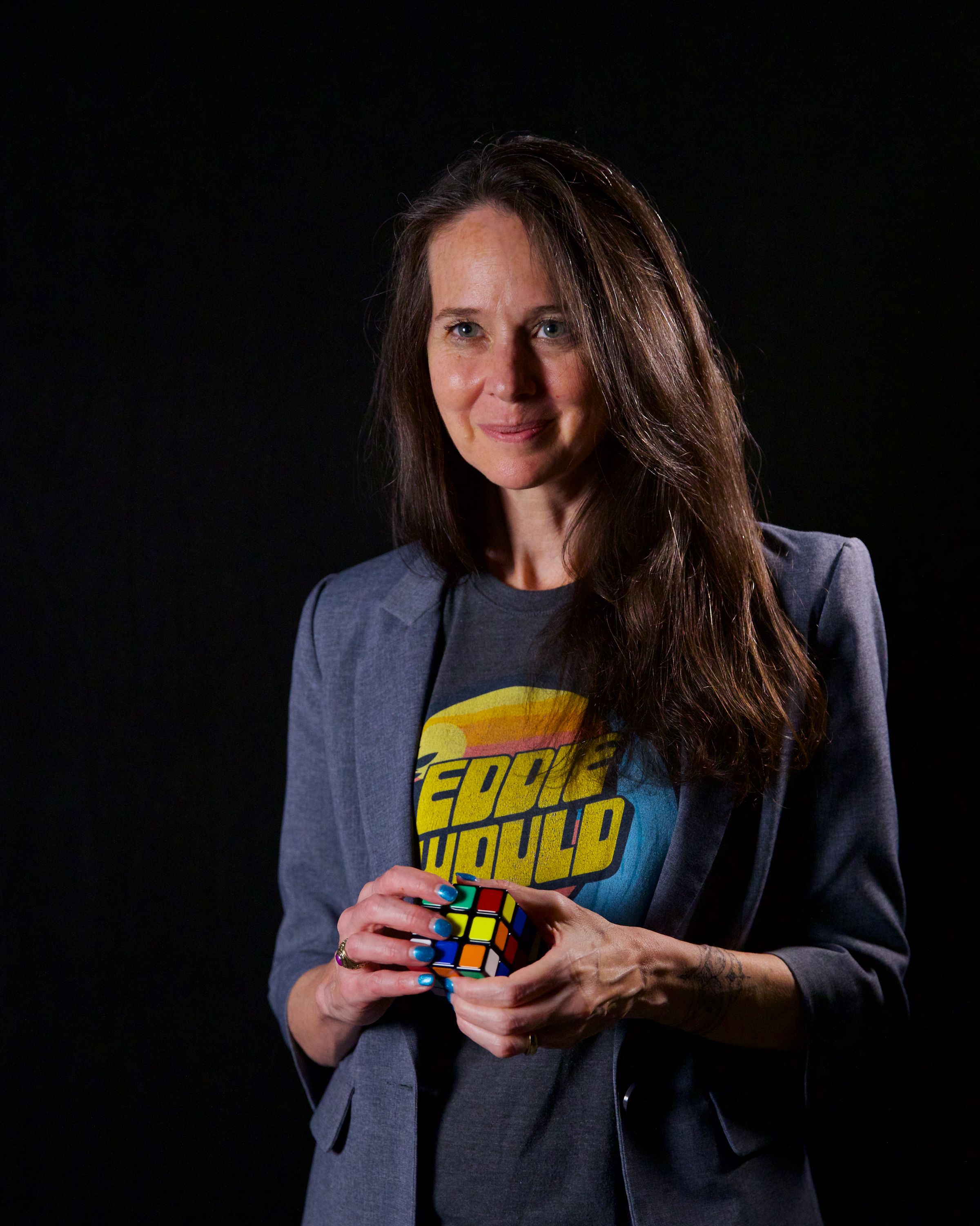 Official portrait of CISA Director Jen Easterly - she is holding a rubik's cube
